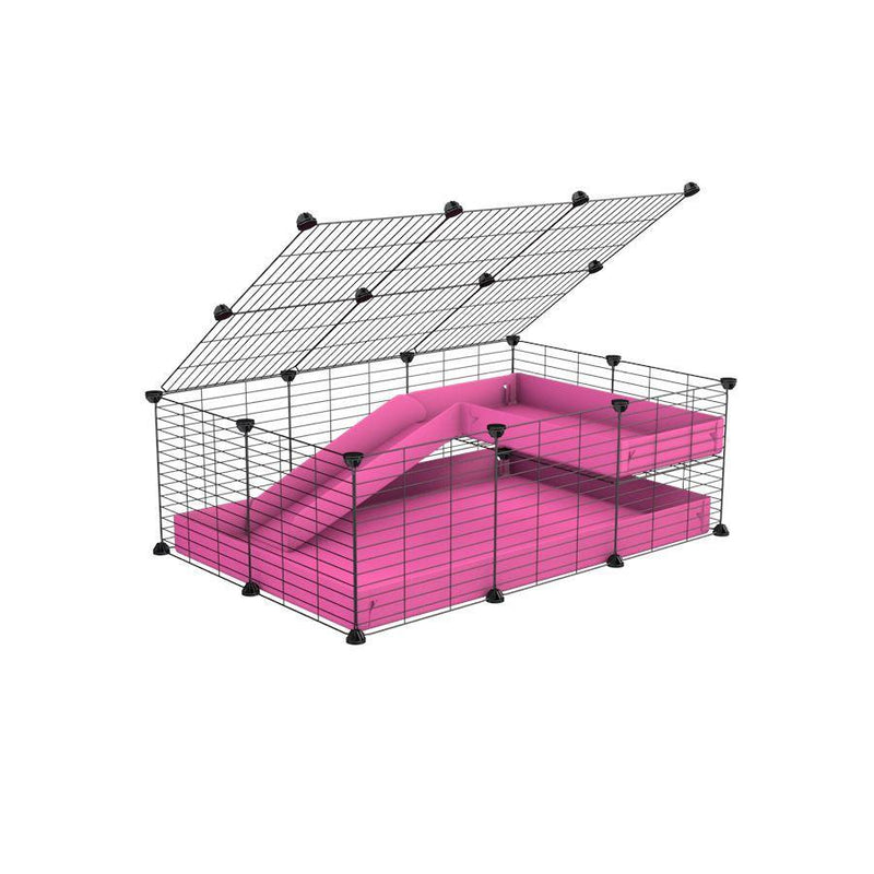 une cavy C&C cage 3x2 pour cochons d'inde avec une rampe un loft un couvercle un coroplast rose et grilles