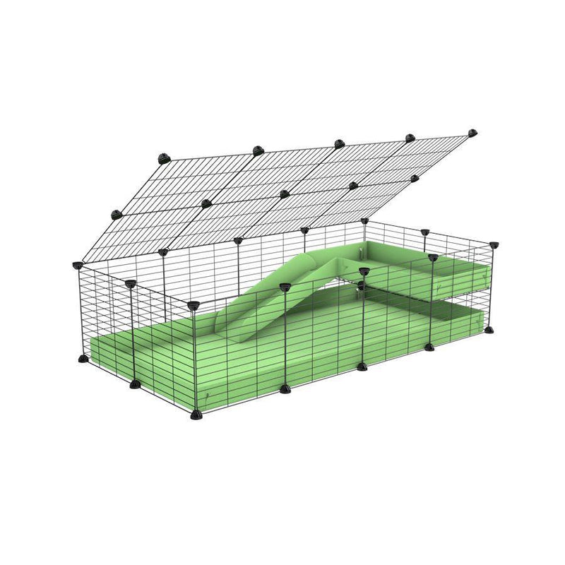 une kavee cage 4x2 pour cochons d'inde avec une rampe un loft un couvercle un coroplast vert pistache grilles