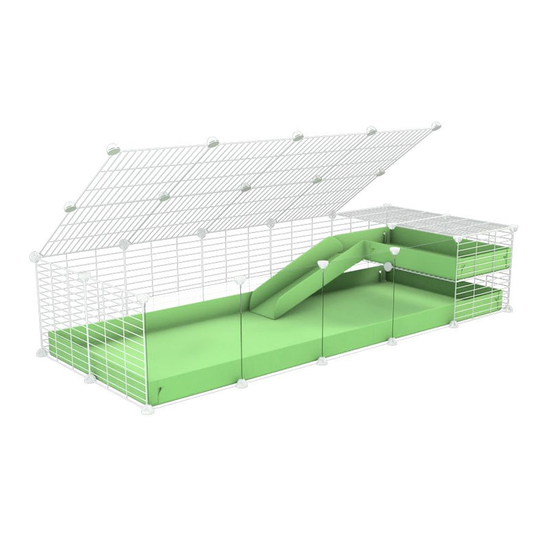 une kavee C&C cage 5x2 avec panneaux transparents en plexiglass  pour cochons d'inde avec une rampe un loft un couvercle un coroplast vert pistache et grilles blanches