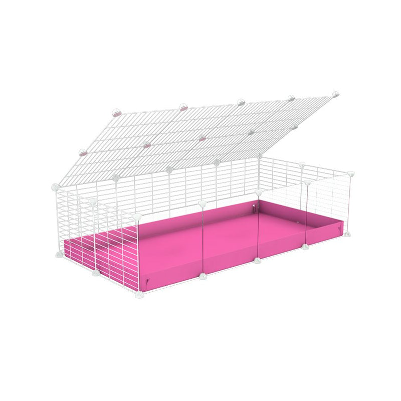 une cavy cage 4x2 pour cochons d'inde avec panneaux transparents en plexiglass avec couvercle coroplast rose et grilles blanches avec barreaux etroits de kavee