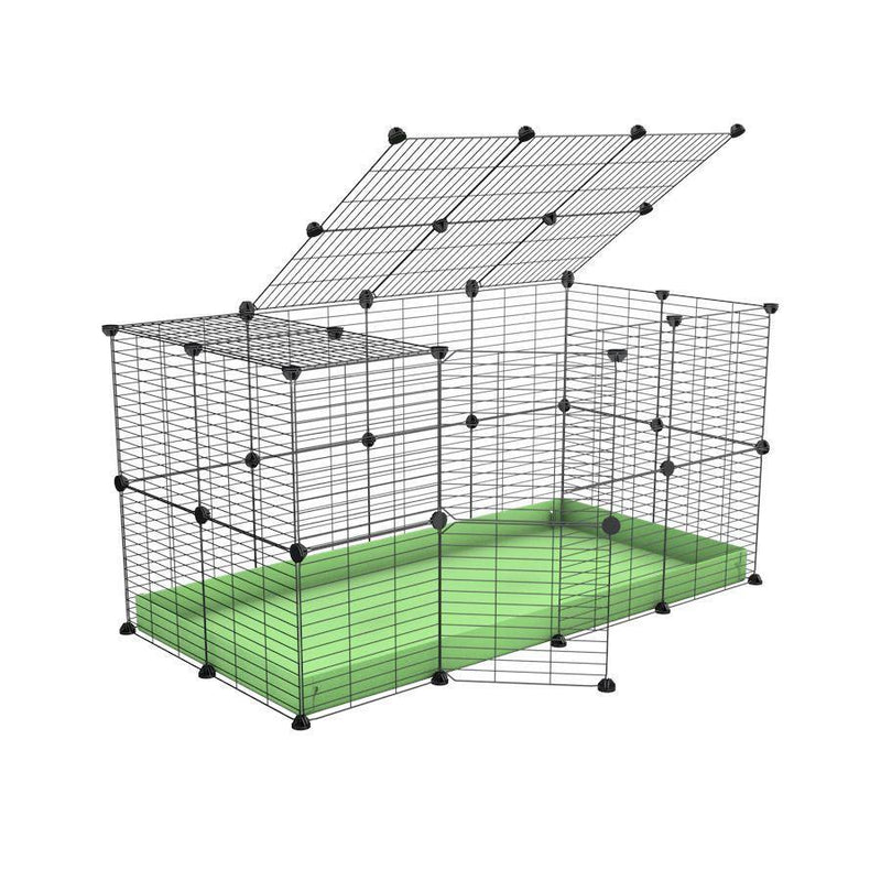 Une kavee cage modulaire 4x2 pour lapins avec un couvercle un coroplast vert pistache et des grilles a barreaux etroits