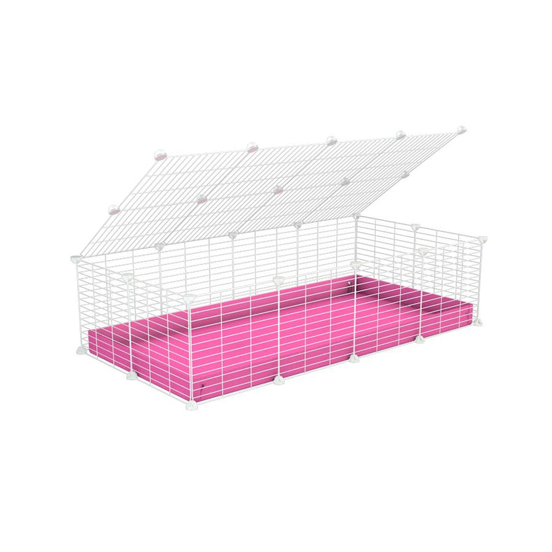 une cavy cage 4x2 pour cochons d'inde avec couvercle coroplast rose et grilles blanches avec barreaux etroits de kavee